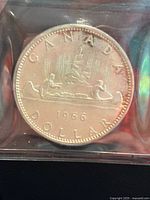 1966 Canada silver dollar reverse showing Voyageur design in ICCS holder