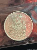 Reverse of 1966 Canada 50-cent coin showing coat of arms