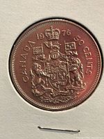 Reverse side showing Canadian Coat of Arms, date 1976, denomination 50 CENTS