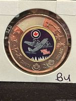 Reverse of 2024 coloured RCAF $2 coin in holder