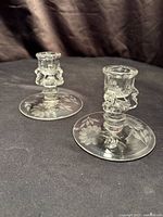 Both candlesticks angled view showing form