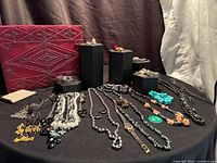 Group view showing jewellery chest and assorted items spread on table