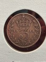 Reverse side with crown, numeral 3, date 1911