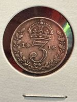 Reverse of 1916 threepence crown over 3