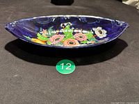 Top view of cobalt blue Maling oval dish showing floral decoration and rim detail