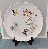 Front view of Lenox Butterfly Meadow Monarch plate on stand