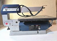 Left side profile of Ryobi SC-160 scroll saw showing body and table