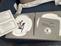 Two Spode collector plates in original boxes with certificate of authenticity included.