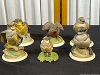 All six Boehm baby bird figurines on display