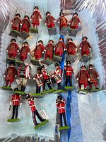 Group of approximately 25 Britains British Guards toy soldiers in container