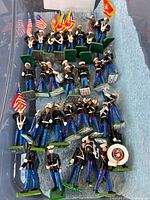 Top view of all Marine Band toy soldiers in bin