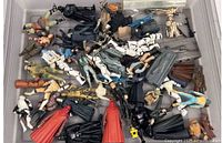 Overview of entire lot of loose Star Wars figures and accessories in plastic tote