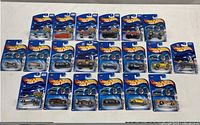 Group shot of twenty sealed Hot Wheels cars on tabletop