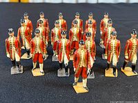 Front view showing group of soldiers in red uniform