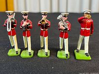 Front view of all five Britains band soldiers