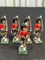 Five metal Highlander soldier figures front view
