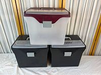 Front view showing all three bins stacked, displaying colors and latches