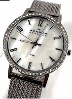 Front view showing dial, crystal bezel, branding