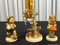 All three Goebel porcelain child figurines front view