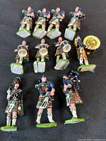 All fifteen metal band pieces laid out on black background