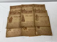 Nine editions of 1889 Leisure Hour Library magazines arranged in three rows, showing front cover artwork and titles in faded brown ink on yellowed newspaper-quality paper.
