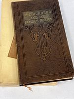 Brown hardcover book titled 'One Hundred and One Famous Poems' with embossed design on cover.