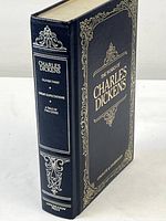 Spine of the Charles Dickens book showing the included novels and publisher name Longmeadow Press.