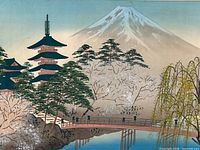 Close-up of the framed print showing the detailed image of Mt. Fuji, pagoda, bridge, and cherry blossom trees.