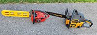 Poulan Pro PP3516AVX chainsaw and Homelite Super 2 chainsaw side by side