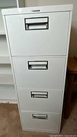 Full front view of 4-drawer metal cabinet