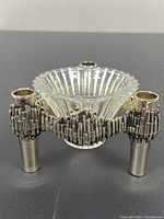 Front view showing metal candlestick and glass insert