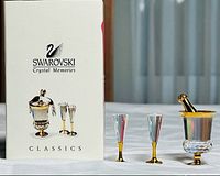 Box front and three miniature pieces displayed