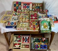 Overview showing all boxed ornaments, lights, and wrap on table