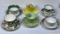 Six assorted teacup and saucer sets