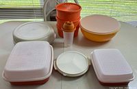 Group shot of all nine Tupperware pieces with lids