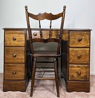 Front view of desk with six drawers and matching chair