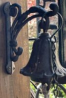 Cast-iron bell on wooden post
