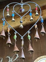 Front view showing heart frame, glass beads, bells