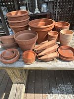All terracotta and clay pieces displayed on table