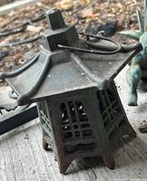 Green patinated cast iron pagoda lantern with hanging loop