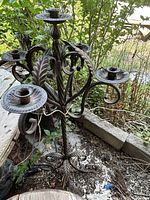 Full view of wrought iron candelabra showing five arms and base