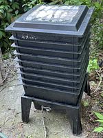 Full view of Worm Factory 360 composting bin showing lid, eight trays, and base