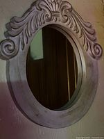 Round / oval carved wood mirror with crest