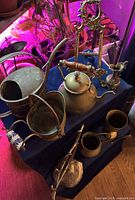 Group shot of all brass items on table