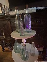 All six bottles displayed on tiered stand