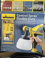 Front of retail box showing product details and image of sprayer