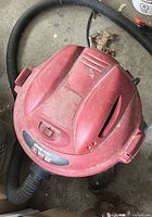 Top view of red Craftsman wet/dry vacuum showing hose connection and control panel