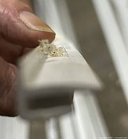 Close-up of vinyl outside corner bead profile and condition