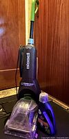 Full view of carpet cleaner and cleaning formula bottle