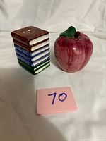 Apple and book stack shakers front view
